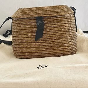 Cesta woven handbag w black leather strap & accents. Long enough for cross body